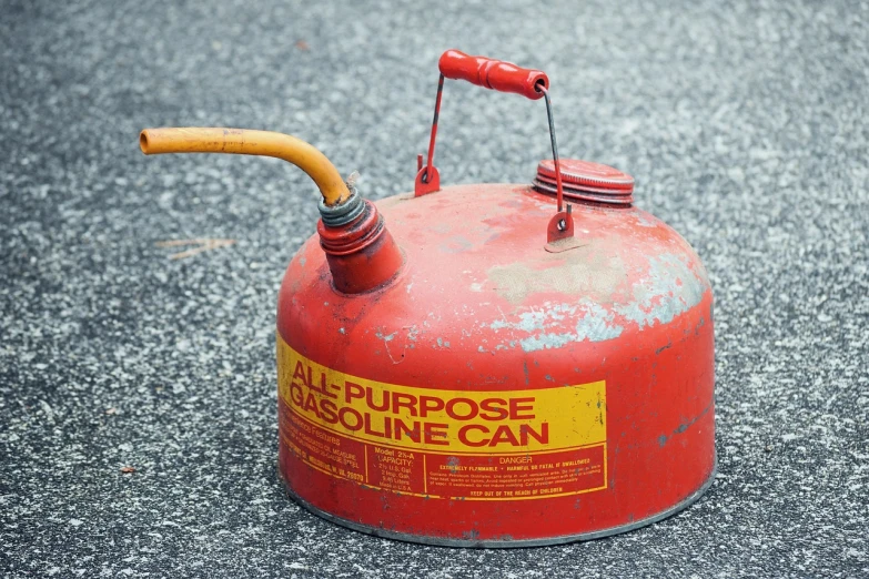 a red gas can with a yellow hose sticking out of it, a picture, by Richard Carline, auto-destructive art, taken in the early 2020s, hyperdetailed, gas lanterns, profile picture