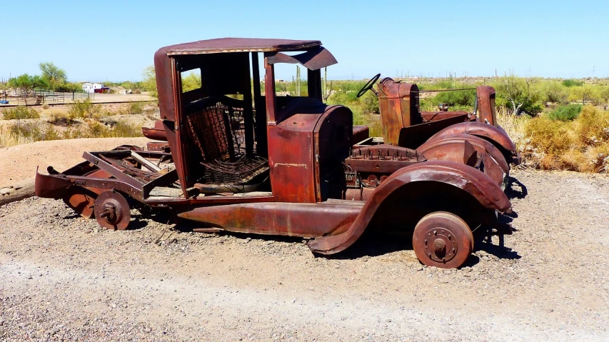 an old rusted truck sitting in the dirt, by Gwen Barnard, flickr, 1929, tucson arizona, flattened, front and side view