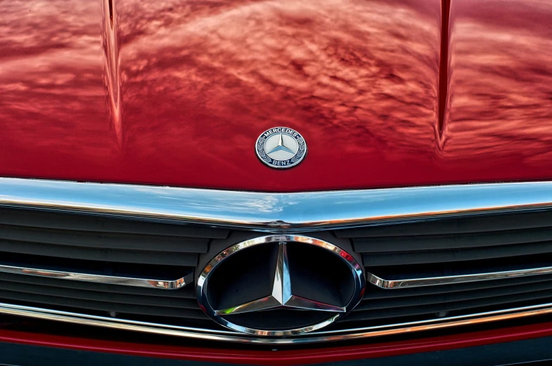 a close up of a mercedes emblem on a red car, a photo, by Hans Schwarz, precisionism, phone wallpaper, protrait, 4 0 9 6, classic chrome