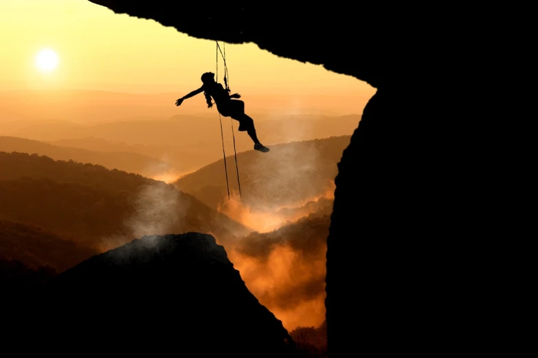 a man that is on a rope in the air, by Mathias Kollros, romanticism, huge chasm, end of the day, working hard, speleothems