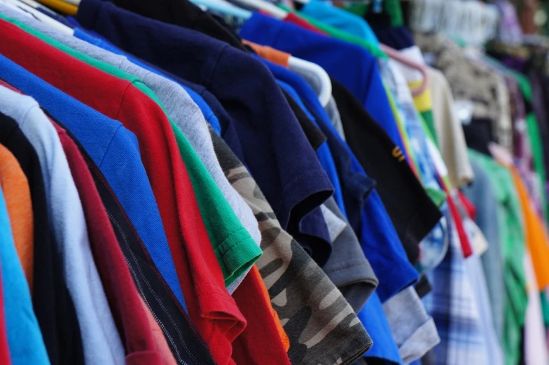 a bunch of shirts hanging on a rack, a picture, 15081959 21121991 01012000 4k, yard, zoomed in, kid