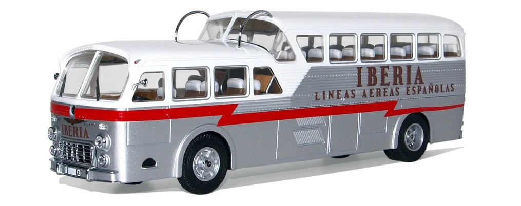 a silver and red bus on a white surface, ho scale, irwin penn, tundra, streamlined