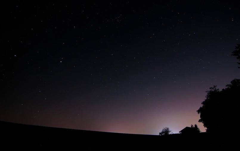 a sky filled with lots of stars next to a tree, by Thomas Häfner, flickr, minimalism, planet in space over the horizon, distant town lights, break of dawn on neptun, shot with a camera flash