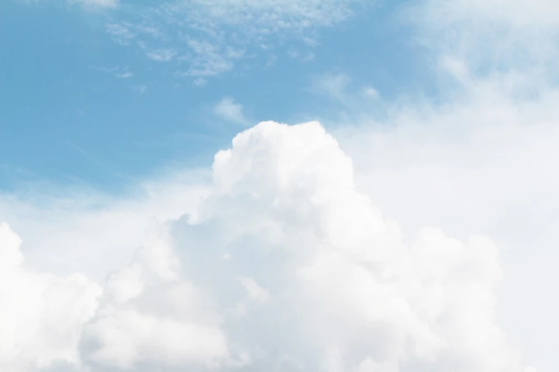 a person is flying a kite in the sky, unsplash, minimalism, giant cumulonimbus cloud, banner, dominant wihte and blue colours, sitting in a fluffy cloud