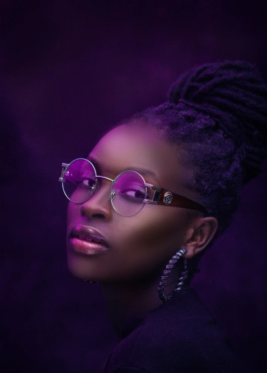 a close up of a person wearing glasses, a portrait, inspired by Chinwe Chukwuogo-Roy, trending on pexels, afrofuturism, dark moody purple lighting, portrait of a beautiful model, girl wearing round glasses, purple color-theme