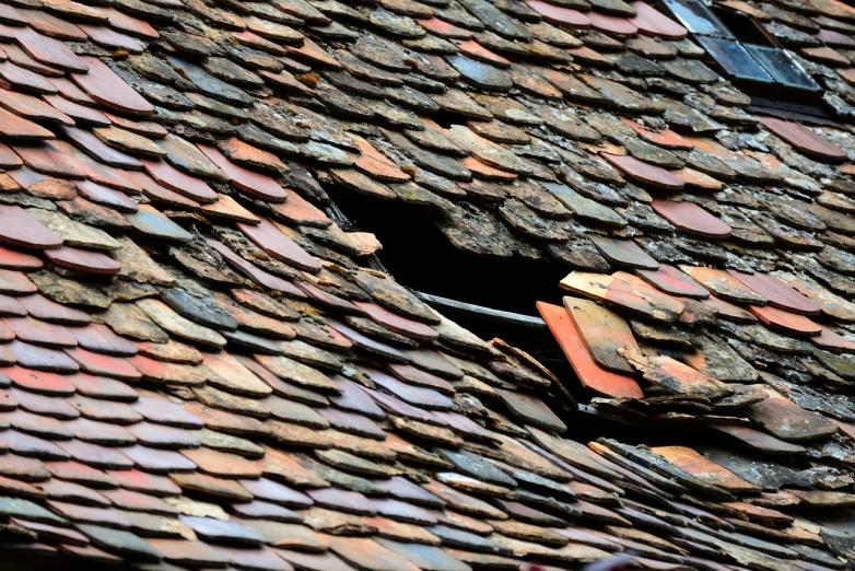 a close up of a roof with a broken window, a mosaic, by Matthias Weischer, shutterstock, ocher, slate, rot, quake