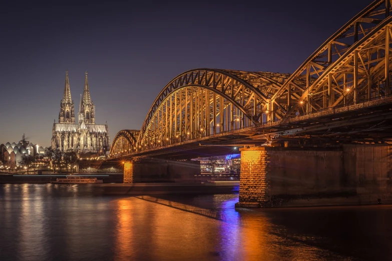 a bridge over a river with a cathedral in the background, a picture, by Thomas Häfner, pexels contest winner, good lighted photo, mega-detailed, skyline showing, 2 4 mm iso 8 0 0