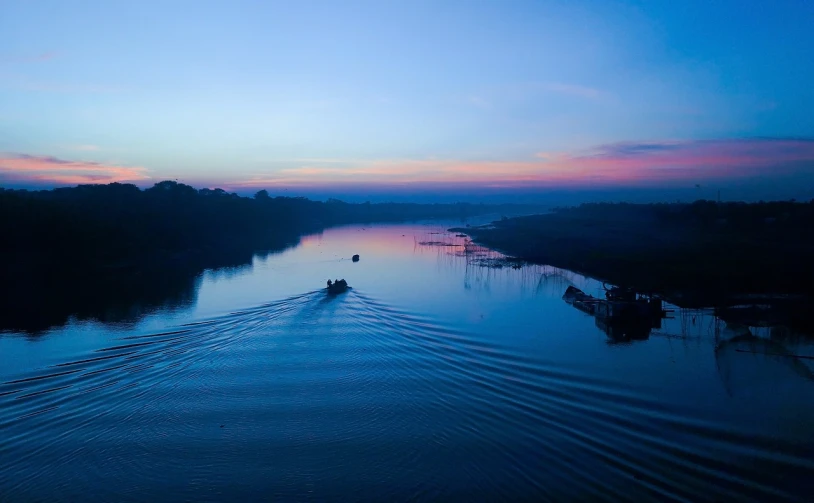 a boat traveling down a river at dusk, by Sudip Roy, hurufiyya, blue river in the middle, early morning sunrise, a high angle shot, sha xi