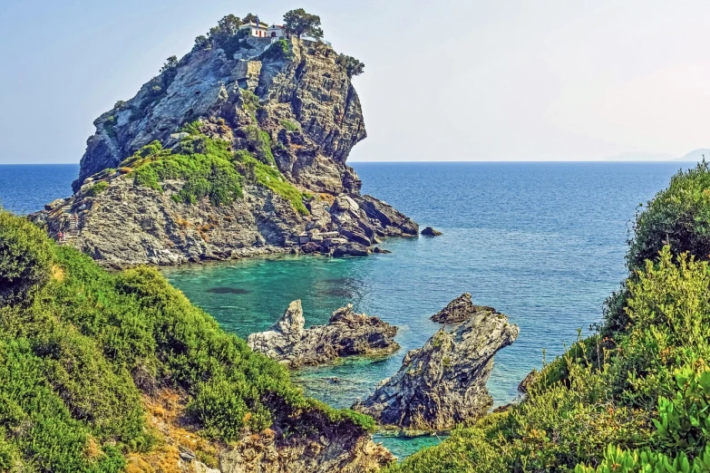 a small island in the middle of the ocean, a picture, shutterstock, greek fantasy landscape, hestiasula head, detailed zoom photo, in the distance is a rocky hill