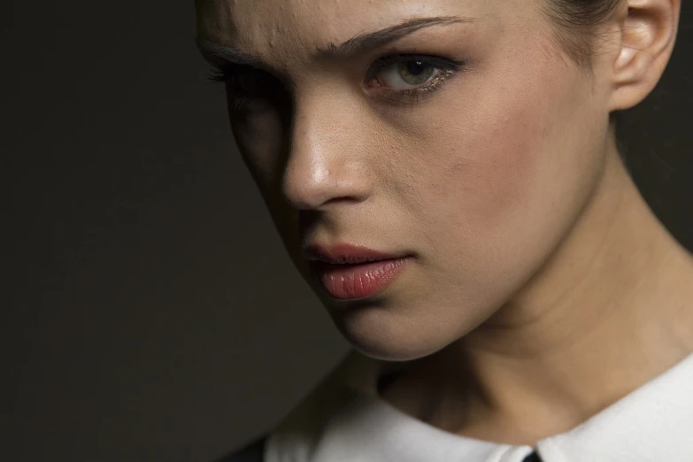 a woman in a white shirt and black tie, by Adam Chmielowski, flickr, photorealism, nadav kander, natali portman, macro face shot, by joseph binder