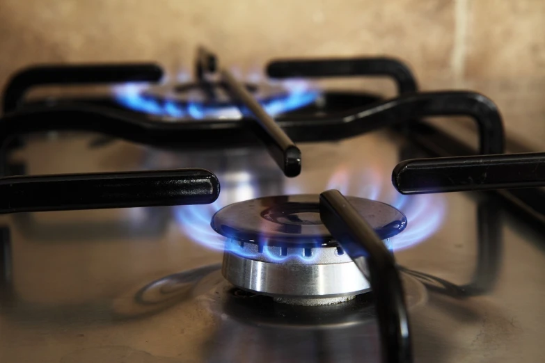 a close up of a gas burner on a stove, by John Murdoch, pixabay, propane tanks, discovered photo, phone photo, portlet photo