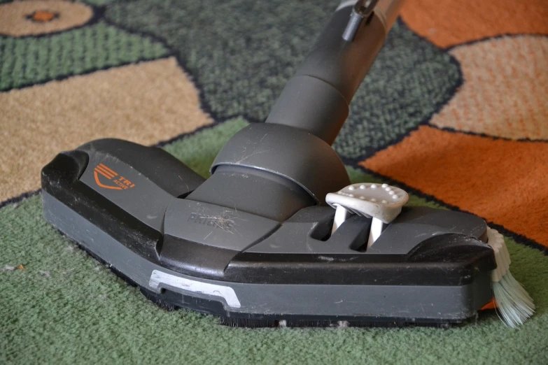 a close up of a vacuum on a carpet, by Loren Munk, hurufiyya, très détaillé, accurate and detailed, sharply shaped, mold