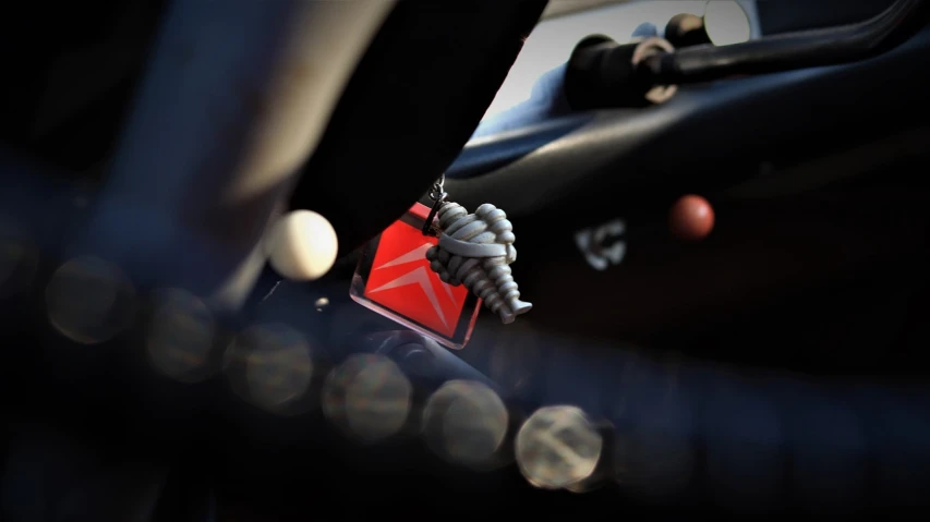 a close up of a steering wheel on a motorcycle, a tilt shift photo, by Etienne Delessert, photorealism, close up shot of an amulet, cone, c 4 d style, inside of a car