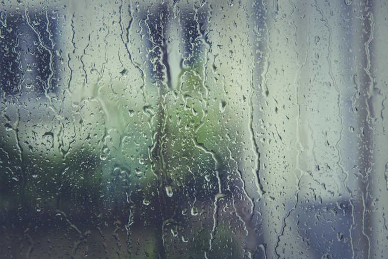 a close up of a window with rain on it, pexels, romanticism, istock, faded, our desperation, green rain