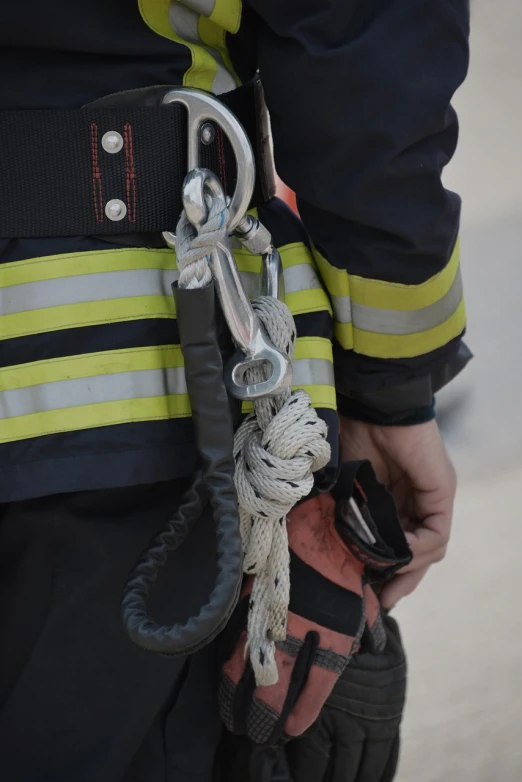 a close up of a person wearing a fireman's uniform, a photo, rope, floro details, technical, webbing