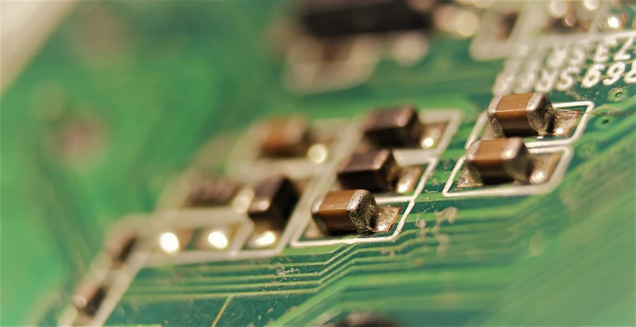 a close up of an electronic circuit board, by Jason Felix, flickr, video, dip-switch, sun shining, angled shot