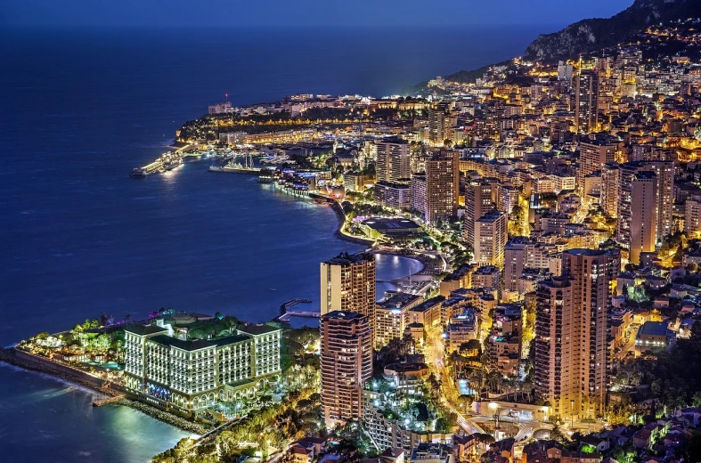 an aerial view of a city at night, by Bernard D’Andrea, shutterstock, fine art, monaco, coastline, alp, usa-sep 20