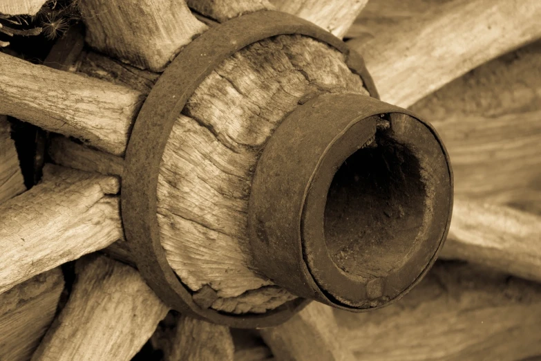 a close up of a wooden wagon wheel, a macro photograph, by Edward Corbett, renaissance, sepia photography, tools, beams, defunct technology