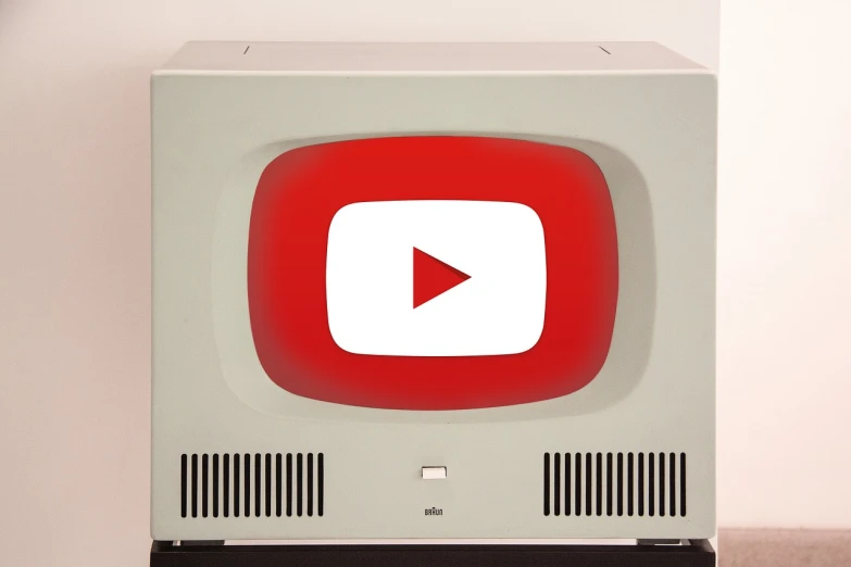 a white and red television sitting on top of a table, by John Luke, reddit, video art, youtube logo, 1 9 6 0, very accurate and detailed, youtube thumbnail