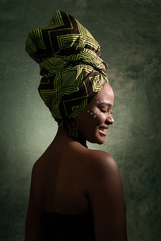 a woman with a turban on her head, a portrait, by Chinwe Chukwuogo-Roy, shutterstock contest winner, afrofuturism, happy and beautiful, greenish skin, womanhood”, bathed in light
