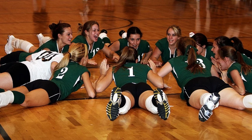 a group of women laying on top of each other on a court, a picture, by Tom Carapic, flickr, volleyball, kneeling!!, novi stars, cutie