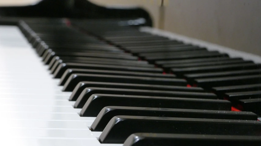 a close up of the keys of a piano, a picture, pexels, looking partly to the left, photograph credit: ap, wikimedia, lit from bottom