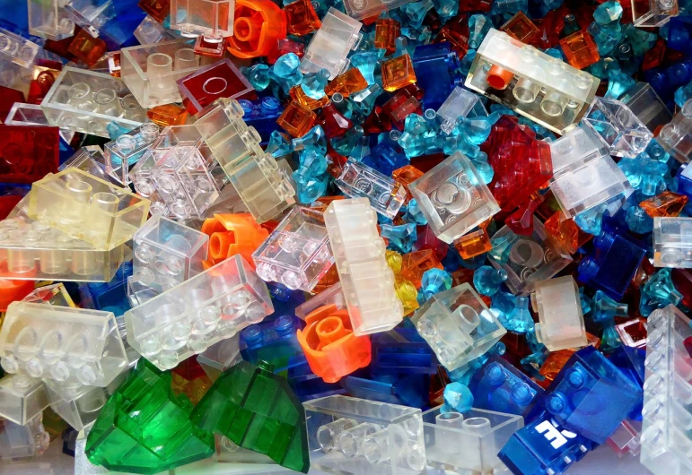 a pile of lego blocks sitting on top of a table, by Jan Rustem, flickr, crystal cubism, translucent greebles, plastic texture, full of colour 8-w 1024, hollow