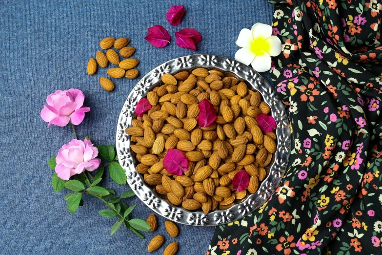 a bowl filled with almonds and pink flowers, dau-al-set, award winning, uttarakhand, persian princess, 🐿🍸🍋