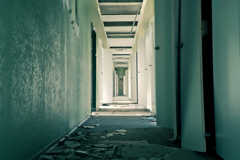 a hallway with a lot of debris on the floor, a photo, post processed denoised, barracks, 33mm photo