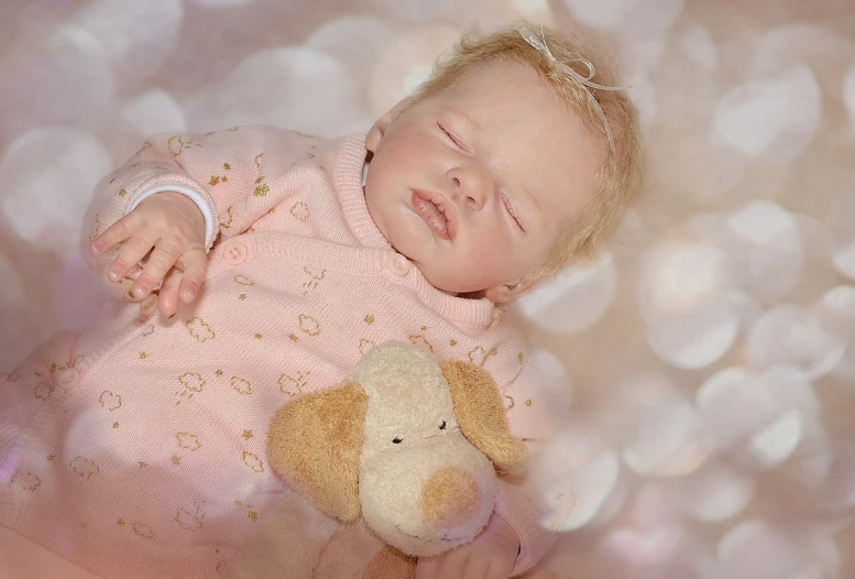 a close up of a baby holding a stuffed animal, a pastel, inspired by Anne Geddes, bokeh in the background only, sleeping beauty, 3 / 4 view portrait, sculpted