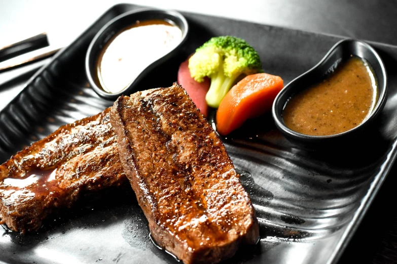 a close up of a plate of food with meat and vegetables, a picture, by Kiyoshi Yamashita, steak, brown sauce, detailed picture, grill