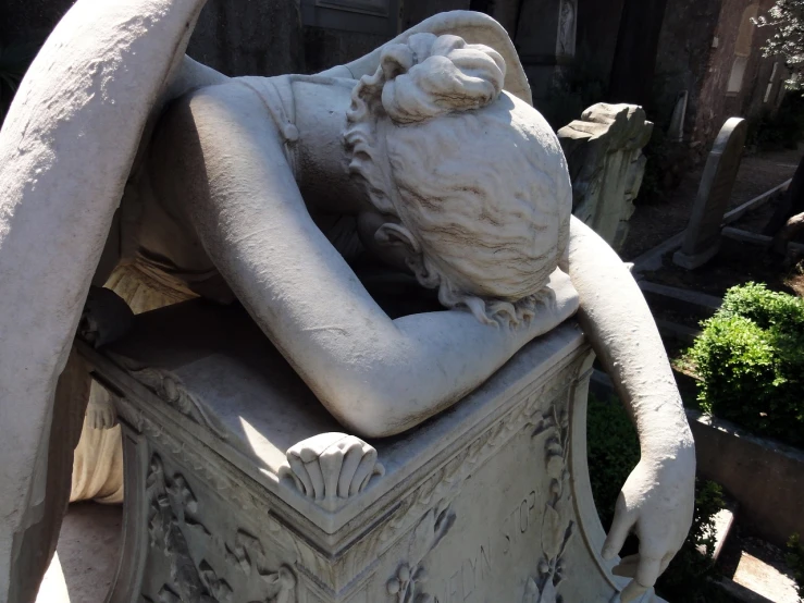 a statue of a man laying on top of a box, by Achille Leonardi, flickr, romanticism, london cemetery, crying and reaching with her arm, detail, naples