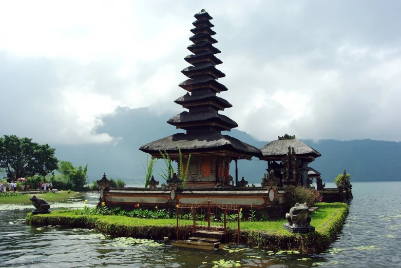 a pagoda in the middle of a body of water, a picture, sumatraism, on a cloudy day, ancient”, very beautiful photo, bali