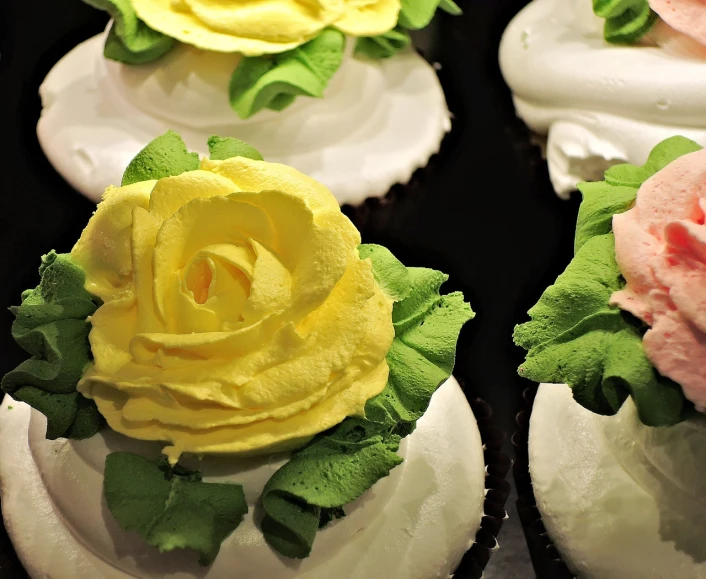 a close up of cupcakes with flowers on them, by Tom Carapic, renaissance, yellow rose, profile close-up view, sculpted, high - contrast