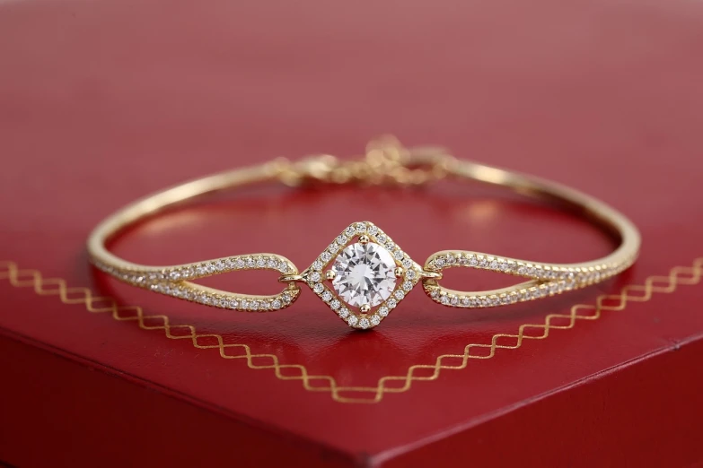 a diamond bracelet sitting on top of a red box, trending on cg society, intricate thin details in gold, 5 mm, sparkels, beutiful