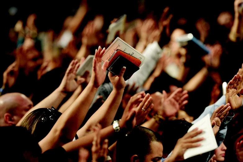 a crowd of people with their hands in the air, a picture, by Matt Stewart, shutterstock, tabernacle deep focus, pews, advert, detailed zoom photo
