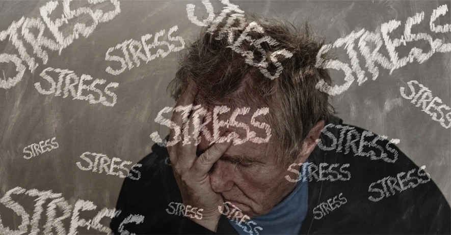 a man with his head in his hands, a picture, shutterstock, stuckism, words, stress, background image, low pressure system
