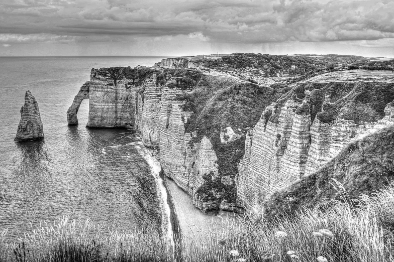 a black and white photo of cliffs near the ocean, by Etienne Delessert, pixabay contest winner, fine art, tone mapped william-adolphe, medieval french landscape, ❤🔥🍄🌪, marsden