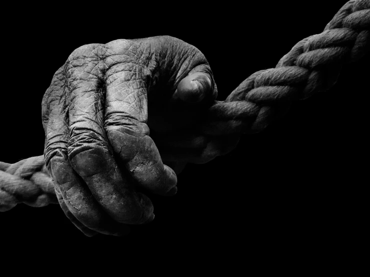 a black and white photo of a hand holding a rope, a black and white photo, inspired by Robert Mapplethorpe, art photography, wrinkles and muscle tissues, andrey gordeev, 8k fine art photography, wallpaper mobile