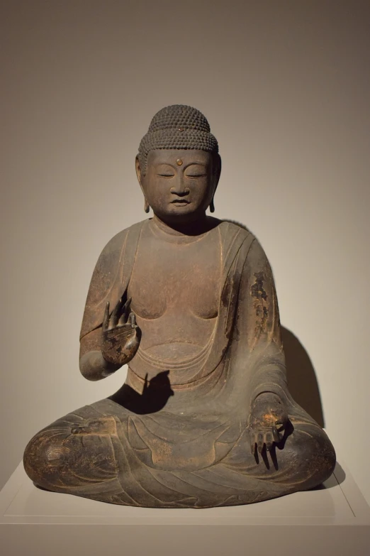 a statue of a person sitting in a meditation position, inspired by Sesshū Tōyō, fine art museum piece, standing gracefully upon a lotus, sits on a finger, anjali mudra