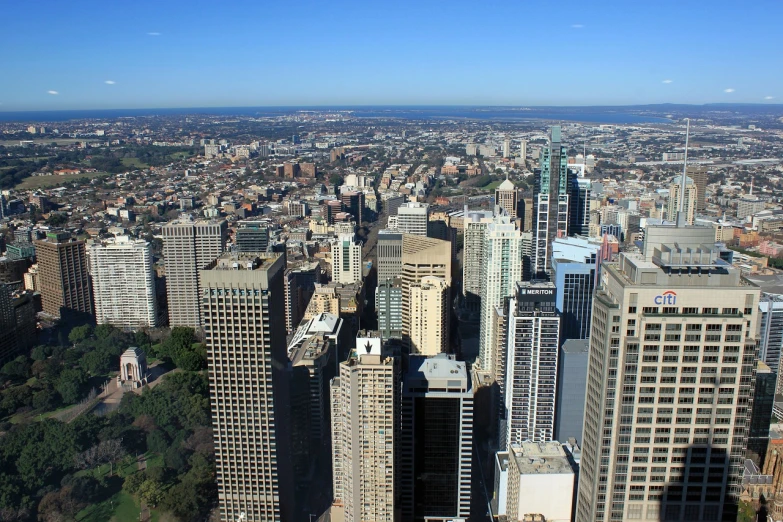 a view of a city from the top of a building, inspired by Sydney Carline, hurufiyya, wikimedia commons, modern high sharpness photo, gigantic skyscrapers, view from the side”