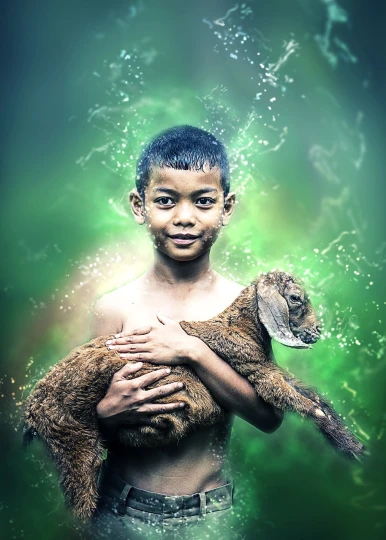 a young boy holding a baby goat in his arms, a picture, sumatraism, water manipulation photoshop, innocent look. rich vivid colors, green blessing, postprocessed)