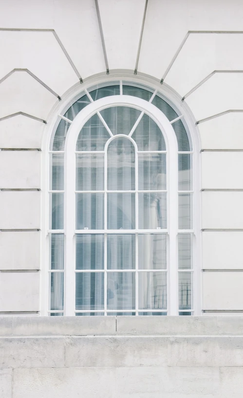 a red fire hydrant sitting in front of a window, inspired by William Hoare, unsplash, neoclassicism, white sweeping arches, white grey blue color palette, clear glass wall, white furniture