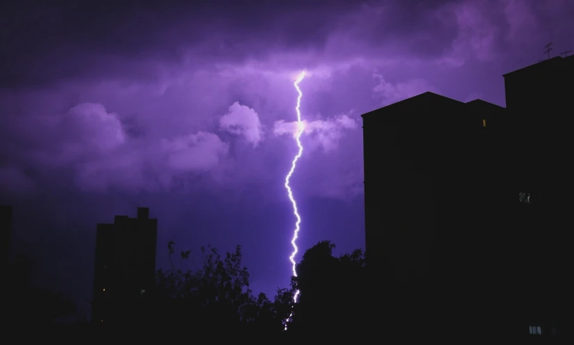 a lightning bolt in the middle of a purple sky, a picture, by Thomas Häfner, pexels, light lighting side view, the walls purple and pulsing, god ray, outdoor photo