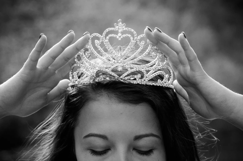 a black and white photo of a woman with a crown on her head, pixabay contest winner, shiny and sparkling, hands pressed together in bow, artificial intelligence princess, devon cady-lee