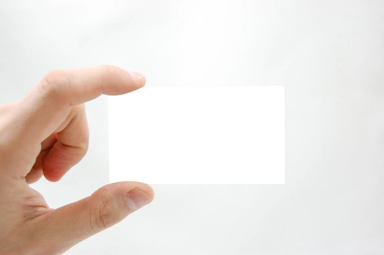 a person holding a white business card in their hand, a picture, product introduction photo, istockphoto, clear edges, japanese