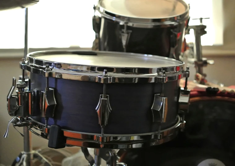 a close up of a drum in a room, by Steve Argyle, shutterstock, cobalt coloration, modern very sharp photo, stock photo