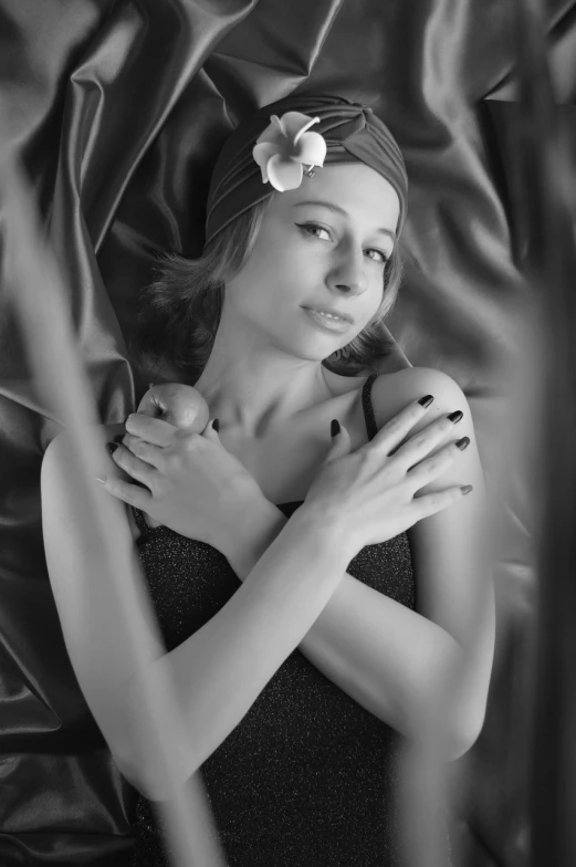 a black and white photo of a woman with a flower in her hair, a black and white photo, inspired by George Hurrell, art photography, wrapped arms, girl with pearl earring, various posed, infra - red