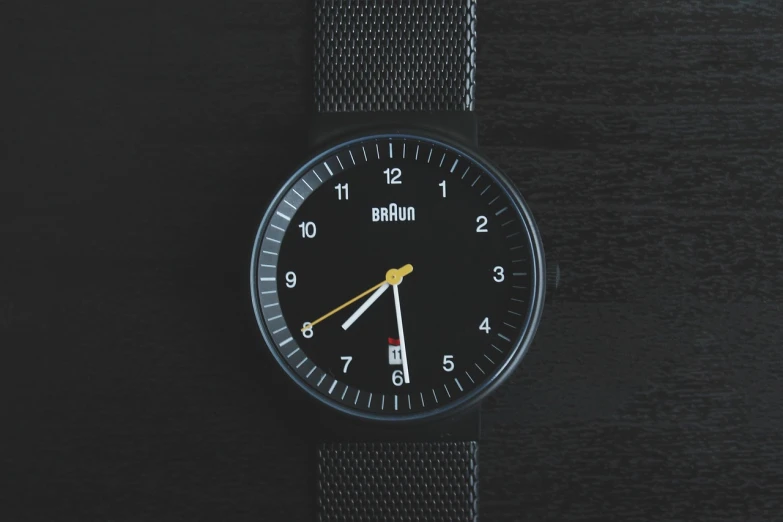 a close up of a wrist watch on a table, a portrait, inspired by Lubin Baugin, unsplash, bauhaus, black plastic, loadscreen”, modern”