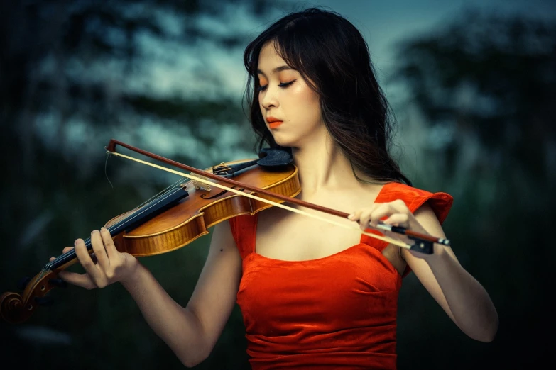 a woman in a red dress playing a violin, a portrait, by Bernardino Mei, shutterstock, beautiful asian girl, outdoor fine photography, amy sol in the style of, stock photo